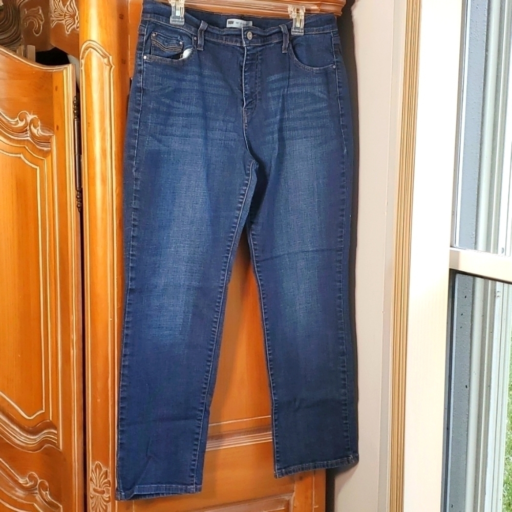 Levi's 505 straight leg‎ jeans. Flap back pocket. Good used condition. 36" 29".
